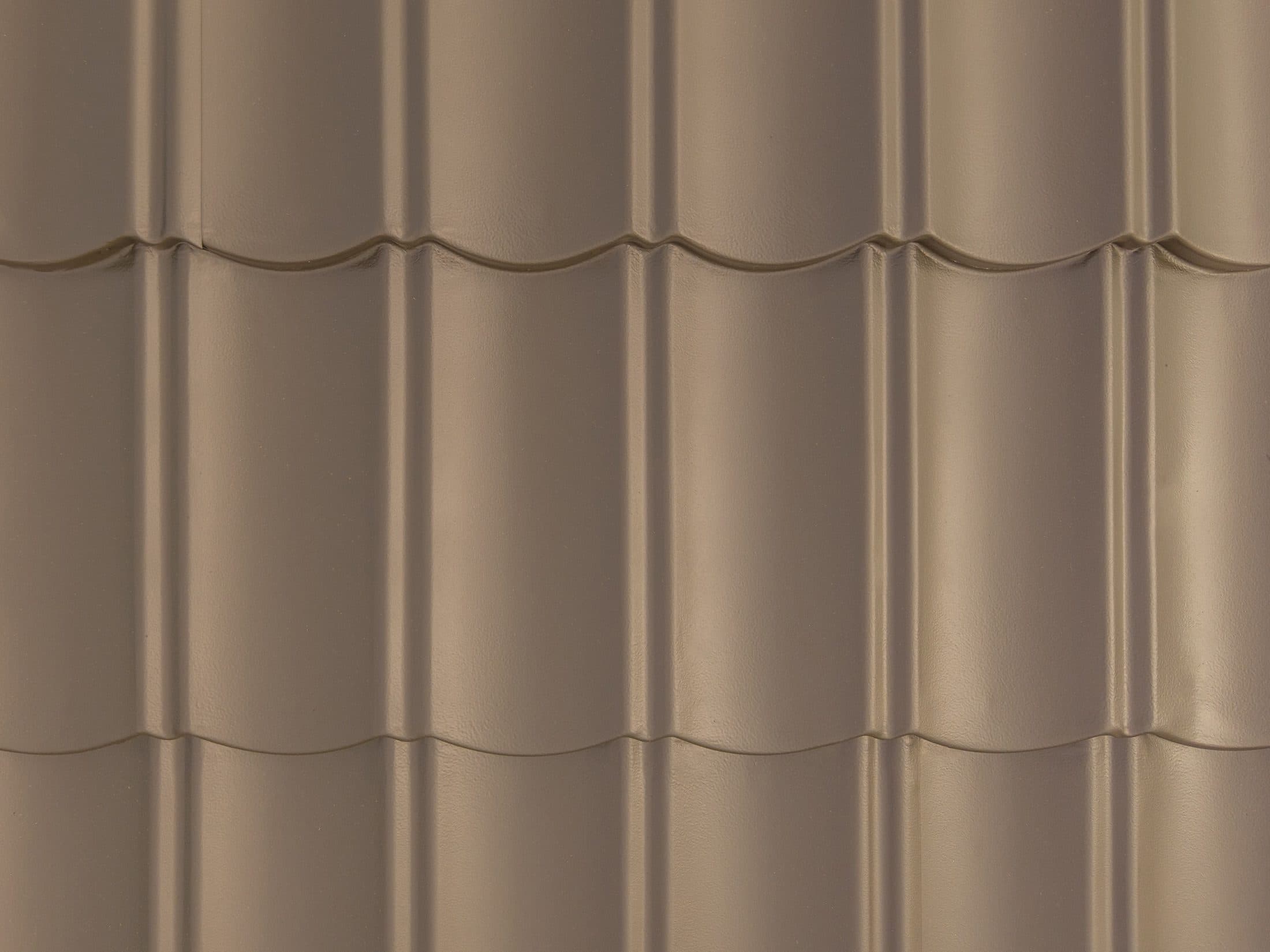 Close detail of the finished roof coating surface on pressed metal tile
