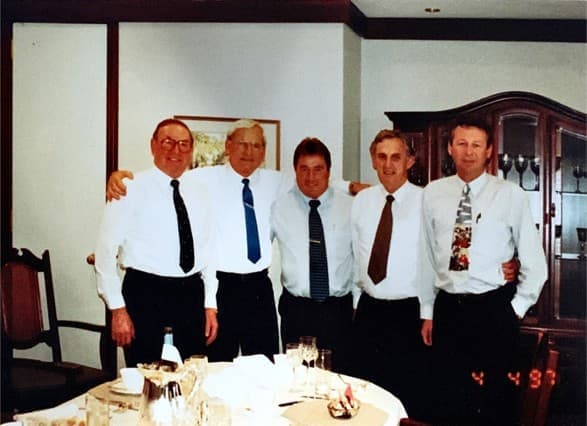 Five colleagues gathered at an Edwards & Hardy function in 1997