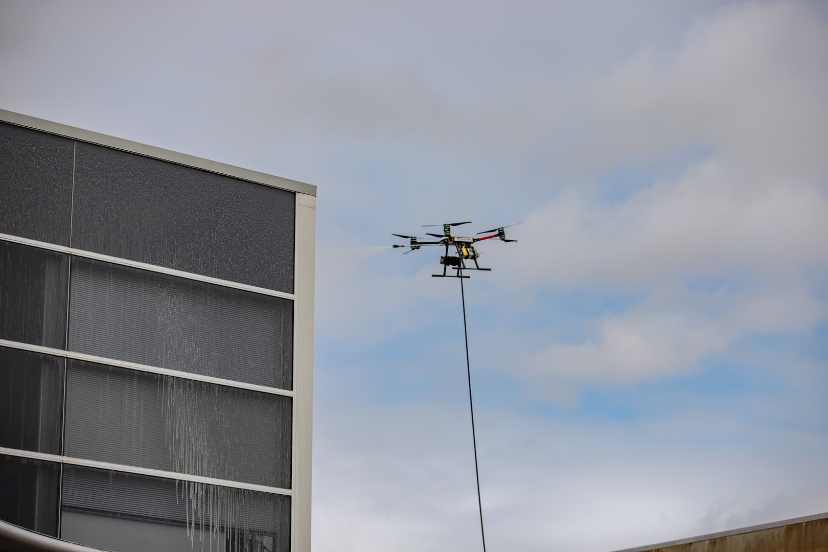 Drone roof inspection being carried out above a residential property