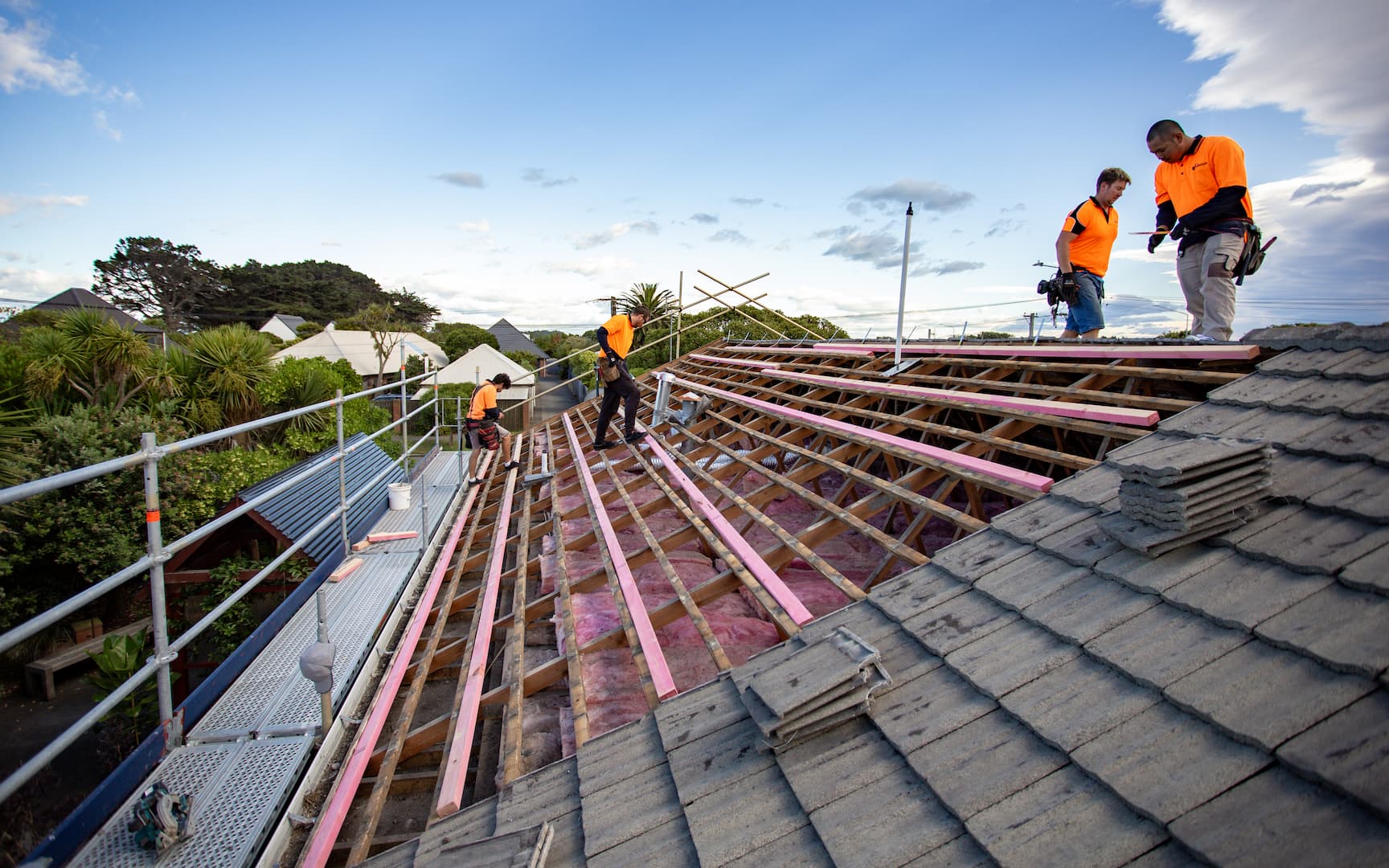 Residential roof being professionally assessed during a routine roof inspection