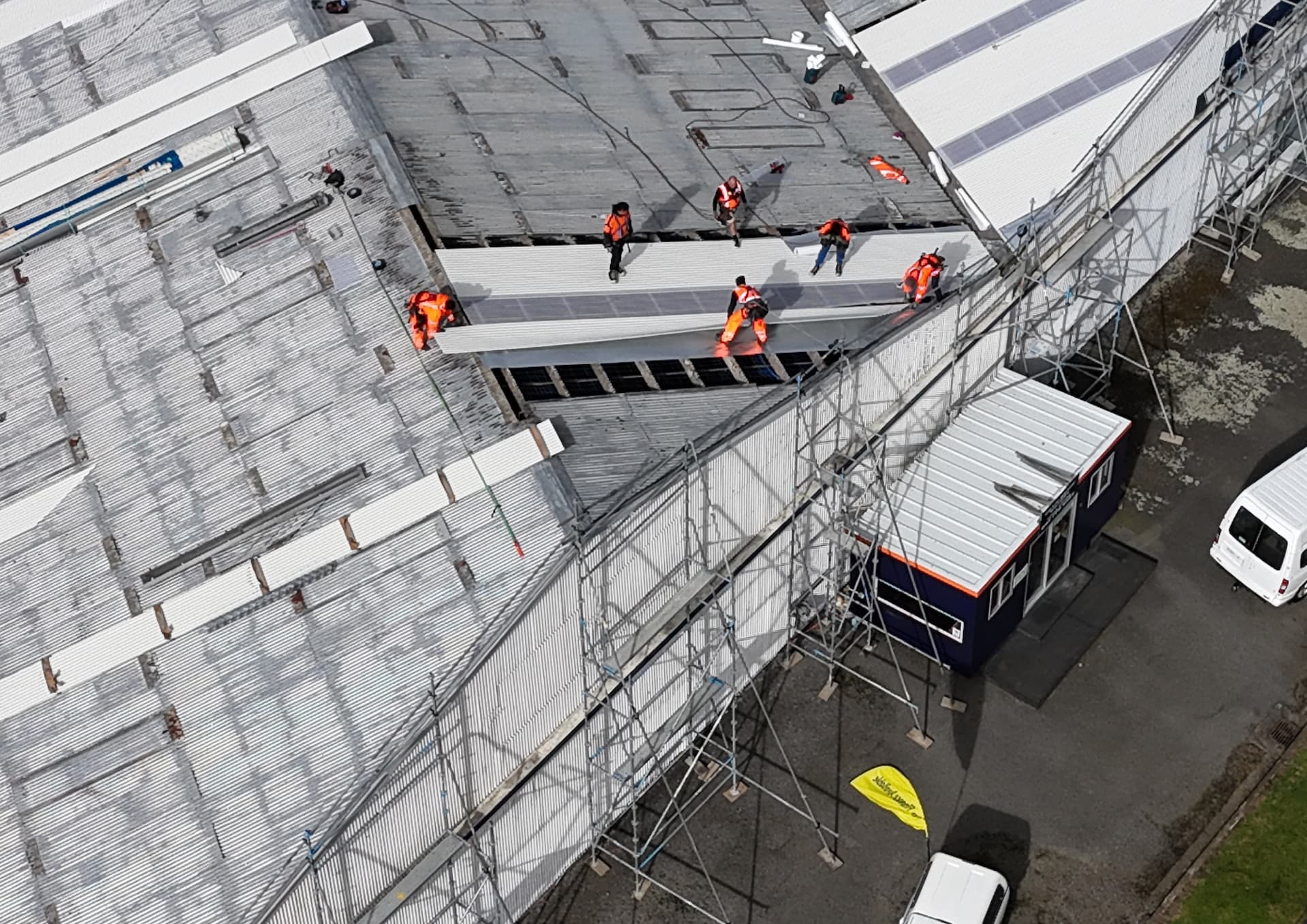 Edwards & Hardy crew installing new roofing sheets on the PGG Wrightson Wool Store