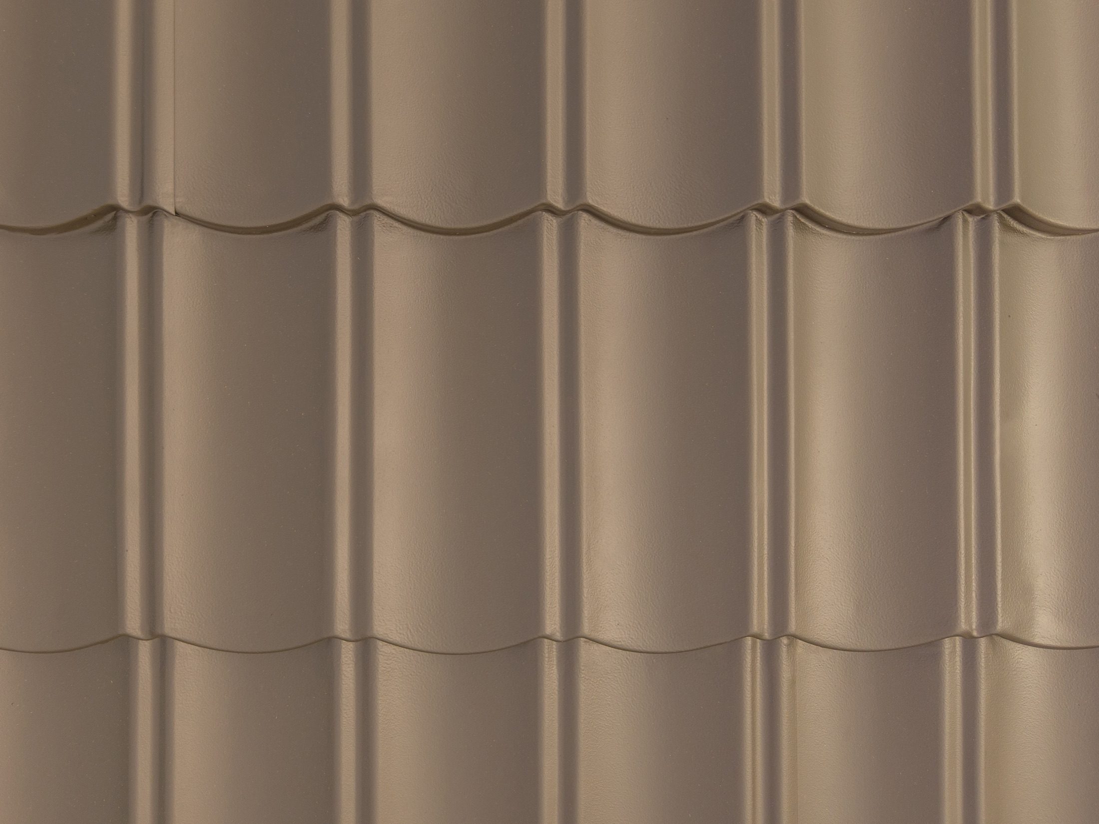 Close detail of the finished roof coating surface on pressed metal tile